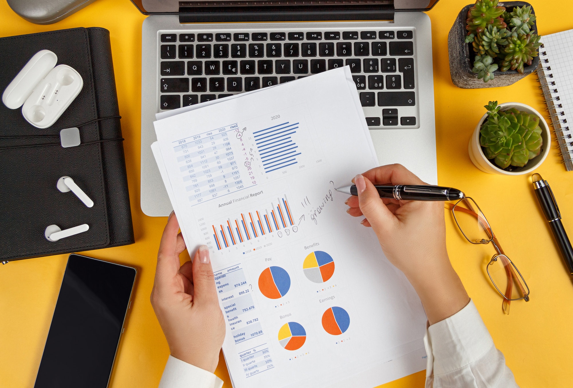 Business woman hands writing on report top view